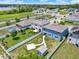 Neighborhood showing well-maintained homes with private backyards and community pond at 5967 Churchill Square Way, Groveland, FL 34736