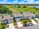 Aerial view of a blue house with a fenced yard, highlighted in a red outline at 5967 Churchill Square Way, Groveland, FL 34736