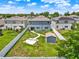 Aerial view of a spacious, fenced backyard with shed, swing set, and lush lawn at 5967 Churchill Square Way, Groveland, FL 34736