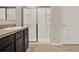 A bathroom featuring a vanity, shower with glass door and tile floors at 5967 Churchill Square Way, Groveland, FL 34736