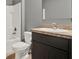 Bathroom with tiled floor, vanity, and tub-shower combo at 5967 Churchill Square Way, Groveland, FL 34736