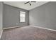 Bedroom featuring neutral walls, and carpet with a window for natural light at 5967 Churchill Square Way, Groveland, FL 34736