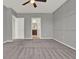 Large bedroom featuring a decorative wall and an ensuite bathroom at 5967 Churchill Square Way, Groveland, FL 34736