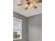 Bedroom featuring a ceiling fan and a window with an outside view at 5967 Churchill Square Way, Groveland, FL 34736