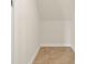 A simple closet featuring neutral walls and flooring, providing ample storage at 5967 Churchill Square Way, Groveland, FL 34736