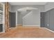 Open living room has a staircase entrance, stylish trim accent and neutral colors at 5967 Churchill Square Way, Groveland, FL 34736