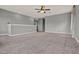 Spacious loft featuring neutral walls and plush carpeting, ideal for a flexible living area at 5967 Churchill Square Way, Groveland, FL 34736