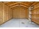 Shed interior with concrete flooring and wood paneling at 5967 Churchill Square Way, Groveland, FL 34736