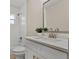 Bathroom with a tub and shower combo, tiled walls, modern vanity, and a plant accent at 614 Plum Ln, Altamonte Springs, FL 32701