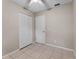 Compact bedroom with tiled floors, closet storage, and a single window for natural light at 614 Plum Ln, Altamonte Springs, FL 32701