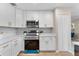Well-equipped kitchen with stainless steel appliances, white cabinets, and modern countertops at 614 Plum Ln, Altamonte Springs, FL 32701