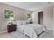 Serene main bedroom featuring a plush bed, soft lighting, and windows offering natural light at 614 Plum Ln, Altamonte Springs, FL 32701
