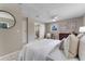 Comfortable main bedroom with neutral tones, backyard view, and an ensuite bathroom at 614 Plum Ln, Altamonte Springs, FL 32701