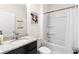 Bathroom features a tub with shower and granite countertop at 616 Griffon Ave, Lake Alfred, FL 33850