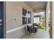 Close-up of a front porch with seating creating a relaxing outdoor area at 616 Griffon Ave, Lake Alfred, FL 33850