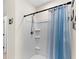 Shower stall with shower curtain and built-in shelving at 616 Griffon Ave, Lake Alfred, FL 33850
