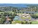 Beautiful aerial view showcasing the community's pool, tennis courts, clubhouse, golf course and stunning lakeside homes at 6161 Blakeford Dr, Windermere, FL 34786