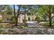 Attractive two-story home with a green front door and mature landscaping at 6161 Blakeford Dr, Windermere, FL 34786