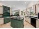 Elegant kitchen with a central island, granite countertops, and custom cabinetry at 6161 Blakeford Dr, Windermere, FL 34786
