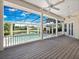 Screened in lanai overlooks the pool and the backyard's scenic view of the pond at 6161 Blakeford Dr, Windermere, FL 34786