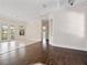 Bright and open living area featuring a hardwood floor, light colored walls, and a partial view of other rooms at 6161 Blakeford Dr, Windermere, FL 34786