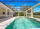 Enclosed pool area featuring a sparkling pool, spa, and brick paving, ideal for relaxation and recreation at 6161 Blakeford Dr, Windermere, FL 34786