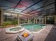 Screened-in pool area with hot tub, fire pit and gazebo perfect for relaxation and outdoor entertaining at 6161 Blakeford Dr, Windermere, FL 34786