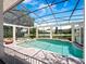 Beautiful screened-in pool with spa, gazebo and backyard views of the pond at 6161 Blakeford Dr, Windermere, FL 34786