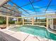 Screened-in pool with spa, gazebo, and lush landscaping, offering a private and relaxing backyard retreat at 6161 Blakeford Dr, Windermere, FL 34786