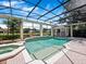 Inviting screened-in pool area with a spa, gazebo, and stunning backyard views at 6161 Blakeford Dr, Windermere, FL 34786