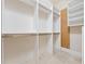 Walk-in closet features shelving, rods for hanging clothes, and pegboard for additional storage at 6161 Blakeford Dr, Windermere, FL 34786