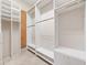 Spacious walk-in closet featuring built-in shelving, drawers, and ample hanging space at 6161 Blakeford Dr, Windermere, FL 34786