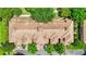 Beautiful aerial view of the townhome complex featuring tile roofs, lush landscaping, and convenient parking at 6205 Miramonte Dr # 103, Orlando, FL 32835
