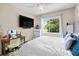 Bright bedroom with a large window offering plenty of natural light and a cozy atmosphere at 6205 Miramonte Dr # 103, Orlando, FL 32835