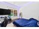 Comfortable bedroom with a large window and decorative lighting, ideal for relaxation at 6205 Miramonte Dr # 103, Orlando, FL 32835