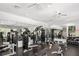 Well-equipped gym with cardio machines, weights, and mirrors for a complete workout at 6205 Miramonte Dr # 103, Orlando, FL 32835