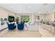 Bright living room featuring modern decor and a cozy seating area with large windows bringing in lots of natural light at 6205 Miramonte Dr # 103, Orlando, FL 32835