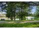 Scenic view of the community pond with a tranquil fountain, surrounded by lush greenery at 6205 Miramonte Dr # 103, Orlando, FL 32835