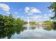 Beautiful view of the pond with a fountain, enhancing the community's appeal and providing a peaceful setting at 6205 Miramonte Dr # 103, Orlando, FL 32835