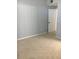 Bedroom featuring neutral carpet and light gray paint at 6304 Raleigh St # 204, Orlando, FL 32835