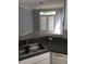 Modern kitchen features granite countertops, stainless sink and exterior access at 6304 Raleigh St # 204, Orlando, FL 32835