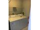 Laundry room area with a full sized washer and dryer unit and shelving at 6304 Raleigh St # 204, Orlando, FL 32835