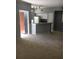 Spacious open-concept living area with a kitchen featuring a breakfast bar at 6304 Raleigh St # 204, Orlando, FL 32835