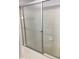 Bathroom shower featuring glass sliding doors and white tile at 6304 Raleigh St # 204, Orlando, FL 32835