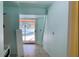 Bright interior view leading to a screened-in pool area, ready for customization at 714 Herbert St, Port Orange, FL 32129