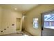 Bright laundry room featuring new paint and door to exterior at 714 Herbert St, Port Orange, FL 32129