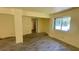 Open-concept room featuring new flooring, awaiting transformation to your personal style at 714 Herbert St, Port Orange, FL 32129