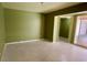 Spacious living area with fresh paint and sliding glass doors leading to the pool at 714 Herbert St, Port Orange, FL 32129