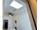 Office featuring a ceiling fan and skylight in need of flooring at 714 Herbert St, Port Orange, FL 32129