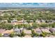 Expansive aerial view of a quiet, lush neighborhood with mature trees and varied rooflines at 7900 Saint Giles Pl, Orlando, FL 32835